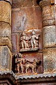 The great Chola temples of Tamil Nadu - The Airavatesvara temple of Darasuram. Panel with attendant figures flanking the niches on the north wall of the sanctuary (the dog vehicle of Bhairava). 